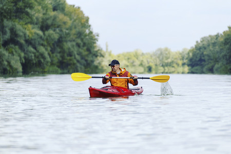 A couple kayaking on Crescent Lake in Park, USAの写真素材