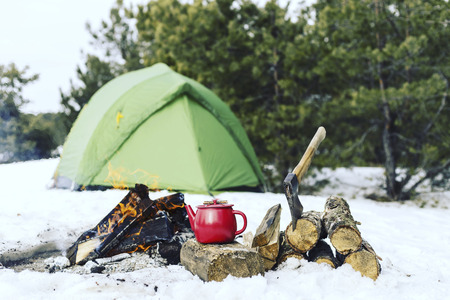 Cooking breakfast on a fire in a tent camp.の写真素材