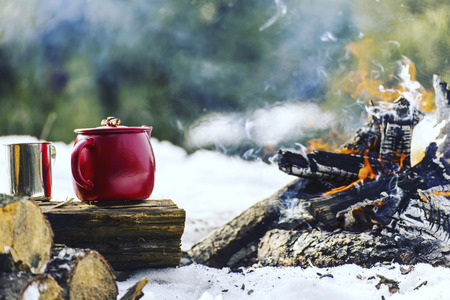 Cooking breakfast on a fire in a tent camp.の写真素材
