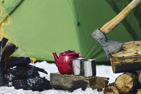 Cooking breakfast on a fire in a tent camp.の写真素材