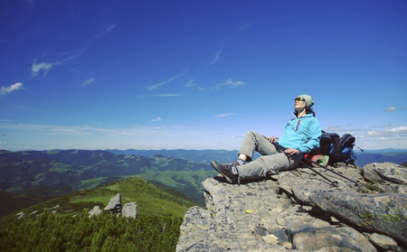 Summer hiking in the mountains with a backpack and tent.の写真素材