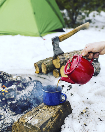 Cooking breakfast in winter camping.の写真素材