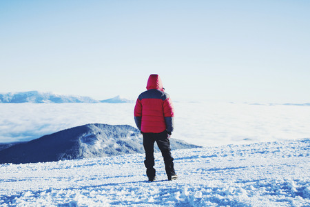 Winter hike in the mountains with a backpack and tent.の写真素材