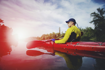 Kayak Water Sports Banner with Copy Space. Senior Kayaker on the Scenic Lake Panoramic Photo.の写真素材