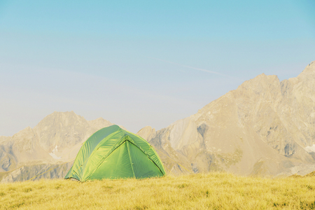 Tent standing on a mountain top.の写真素材