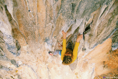 Rock-climbing in Turkey. The girl climbs on the route. Photo from the top.の写真素材