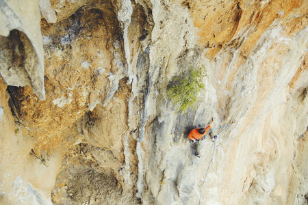 Rock-climbing in Turkey. The guy climbs on the route. Photo from the top.の写真素材
