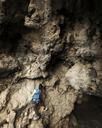 Rock-climbing in Turkey. The climber climbs on the route. Photo from the top.の写真素材
