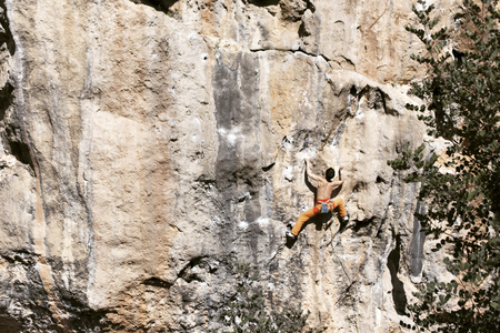 Rock-climbing in Turkey. The climber climbs on the route. Photo from the top.の写真素材