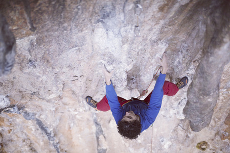 Rock climber on a face of a cliff