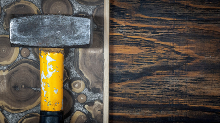 big hammer on a wooden Boardの写真素材