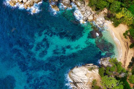 Sea Aerial view. Top view, nature background. Azure sea beach with rocky mountains and clear water...