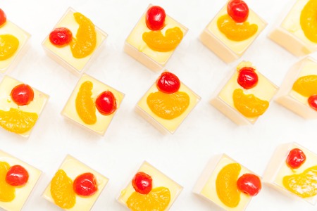 Many fruit cake tiramisu on a white table top view