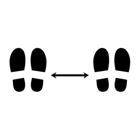 Black footprints social distance isolated on white background. Footsteps shoes silhouette isolated with arrow distance between.のイラスト素材