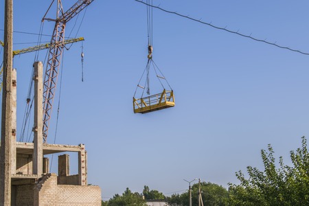 Nice photo of unfinished building with blue sky in the background in a sunny day.の写真素材