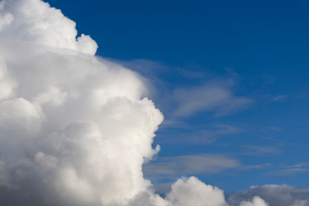 Beautiful white clouds on a blue sky, natural background.