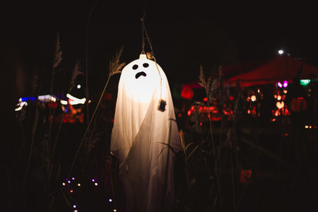 Spooky Halloween photo of a ghost figure in the dark with eerie lighting and misty atmosphere. Perfect for horror, Halloween, and supernatural themes.の写真素材