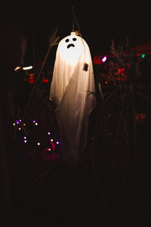 Spooky Halloween photo of a ghost figure in the dark with eerie lighting and misty atmosphere. Perfect for horror, Halloween, and supernatural themes.の写真素材