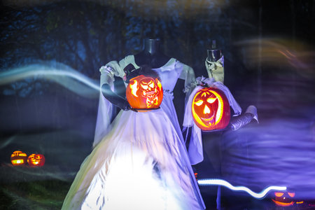 Spooky Halloween photo of a ghost figure in the dark with eerie lighting and misty atmosphere. Perfect for horror, Halloween, and supernatural themes.の写真素材