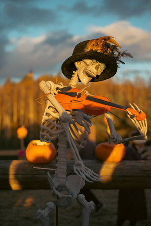 Spooky Halloween skeleton with skull and bones in dark background, creepy horror decoration glowing...