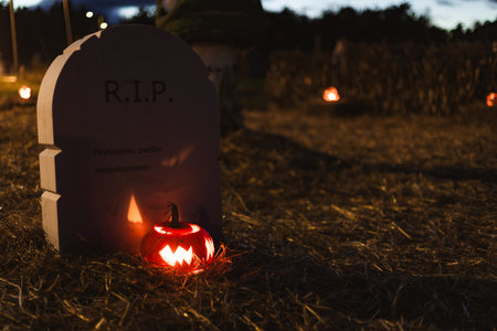 Carved Halloween pumpkins glowing with candlelight inside at night, spooky and festive atmosphere...