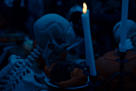 Halloween. Spooky Halloween skeleton with skull and bones in dark background, creepy horror...