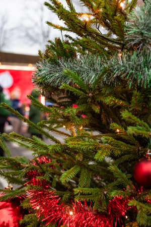 Photo of a Coca-Cola style red holiday truck decorated with festive lights in a snowy winter environment. Strong Christmas mood, iconic festive branding, and bright illuminated details.のeditorial素材