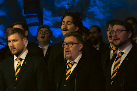 Finland 12/14/2025. Photo of a male choir performing Christmas carols inside a church. The image captures singers in harmony within a beautiful church interior, highlighting tradition, faith, and the warm spirit of Christmas.のeditorial素材