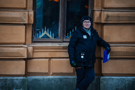 Finland. Turku. December 2025. Photo of television hosts presenting the opening of the Christmas Peace ceremony. The image captures a formal and festive moment with presenters addressing the audience during a traditional holiday celebrationのeditorial素材