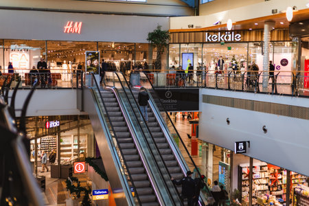 Finland. December 2025. Photo of a large shopping center crowded with people preparing for Christmas...