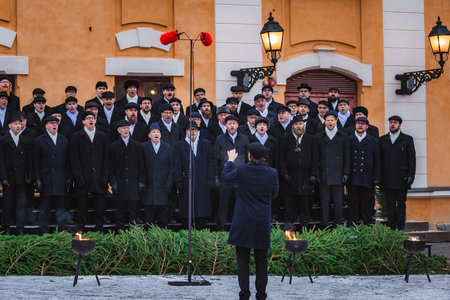 Finland. December 2025. Photo of a conductor directing an orchestra and choir during the Christmas...