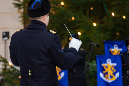 Finland. December 2025. Photo of a conductor directing an orchestra and choir during the Christmas...