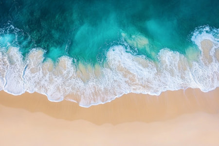 Relaxation is at its peak as turquoise waves softly meet the pristine white sand on a serene beach. This stunning view highlights nature's beauty during a clear day.の素材