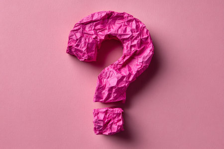 This artwork features a large question mark crafted from fuchsia creased paper, set against a smooth pink background. The design inspires thoughts and questions through its vibrant colors.の素材