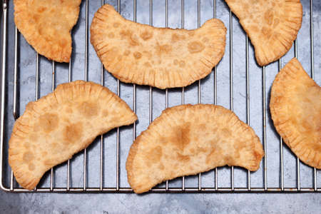 Homemade chebureki, national dish of Tatars, dough with meat and onion.