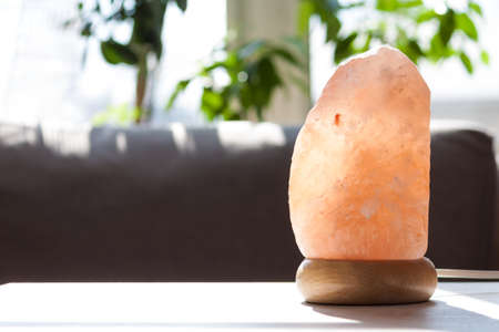 Himalayan pink salt crystals lamp at home. Health and calm concept.の写真素材