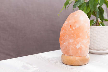 Himalayan pink salt crystals lamp at home. Health and calm concept.の写真素材