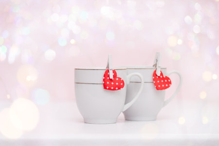 Two cups of coffee, hearts bokeh, Valentine's concept.の写真素材