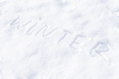 Winter word written on snow. Winter season conceptの写真素材