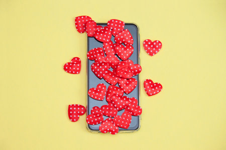 Mobile phone with hearts, love, valentine day concept. Likes and liketime.の写真素材