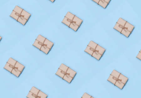 Pattern from kraft paper gift boxes on pink background.の写真素材