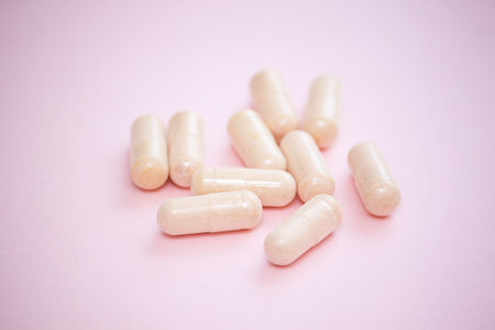 Herbal natural capsules on pink background. Woman health concept.の写真素材