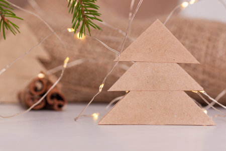 Craft paper in the shape of christmas tree. Eco friendly and zero waste concept. Handmade, diy concept.の写真素材