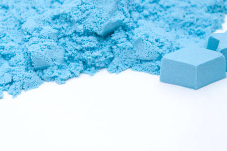 Closeup og blue kinetic sand on the white background. Kids development concept.の写真素材