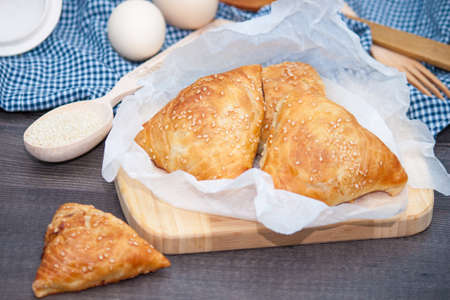 Indian, Asian food delicious samsa or samoses on wooden background.