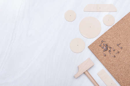 Toy hammer, nails, wooden details. Children develop concept. Copy space, flat lay.の写真素材