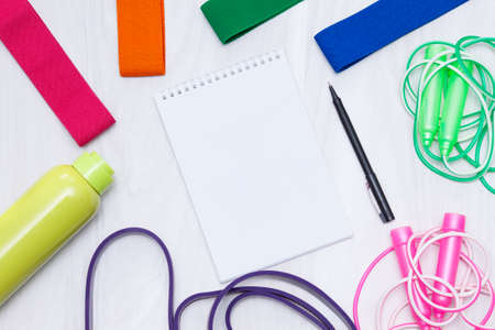 Sports equipment for fitness training on white wooden background. Healthy lifestyle concept.の写真素材