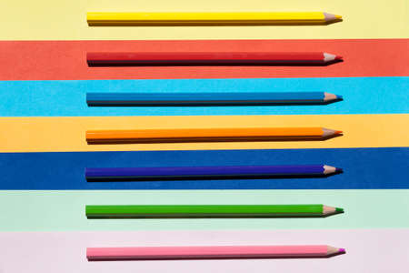 Color pencils on colored background. Back to school, arrangement concept.の写真素材