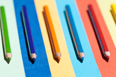 Color pencils on colored background. Back to school, arrangement concept.の写真素材