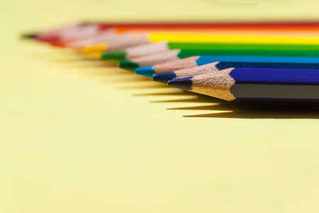 Color pencils on colored background. Back to school, arrangement concept.の写真素材